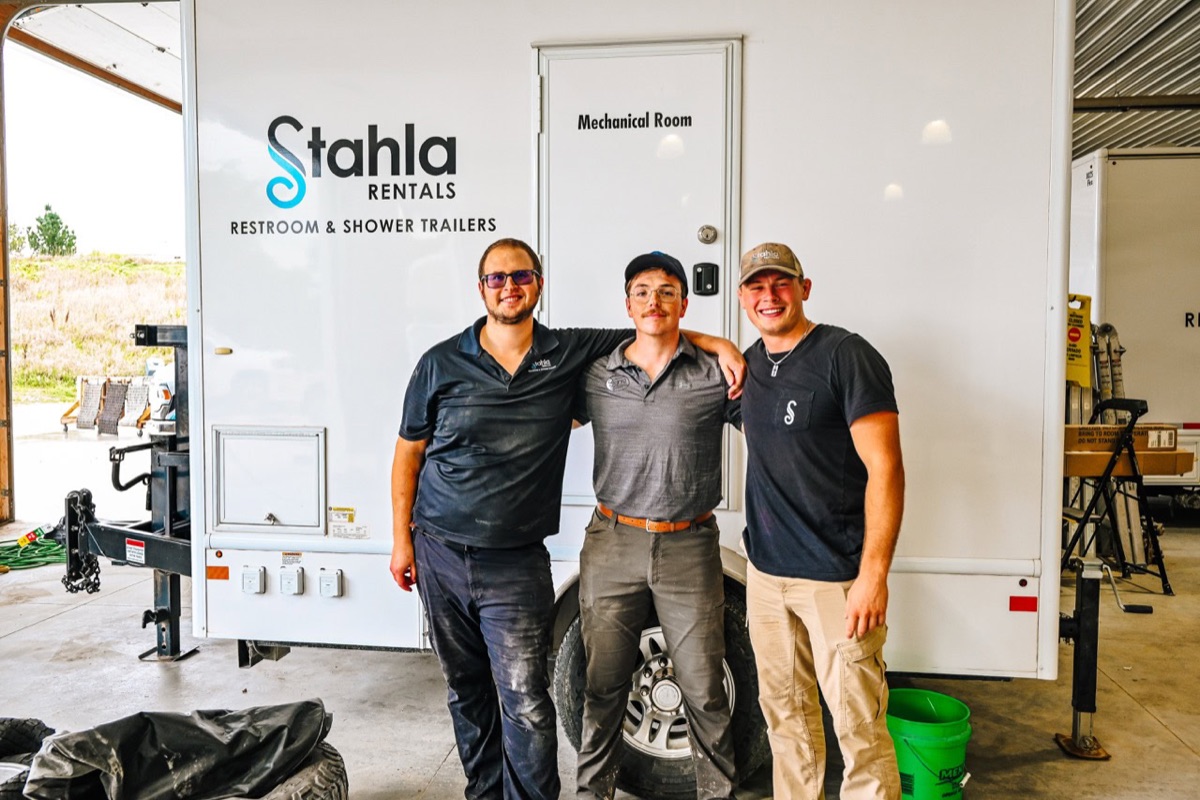 Stahla team in front of branded trailer